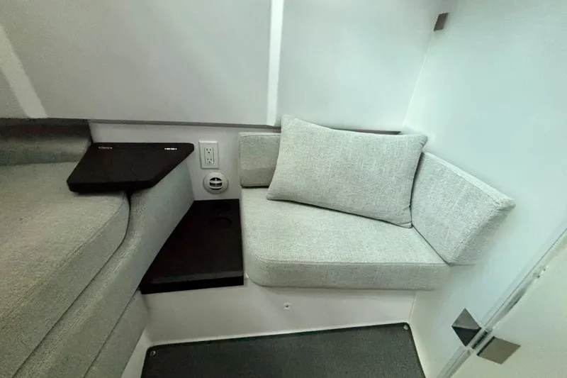 Slide: The Image of 2024 Axopar 37 XC Cross Cabin dashboard with navigation display and steering wheel. - 68