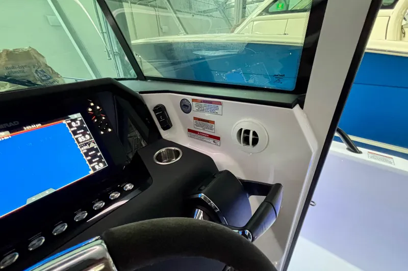 Slide: The Image of 2024 Axopar 37 XC Cross Cabin interior with sleek white design and modern features. - 69