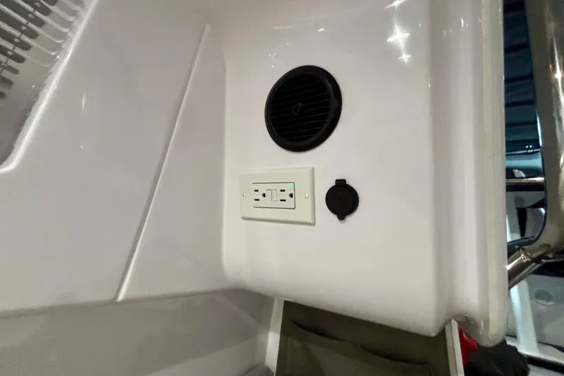 Slide: The Image of Control panel of 2024 Axopar 37 XC Cross Cabin with labeled switches. - 77