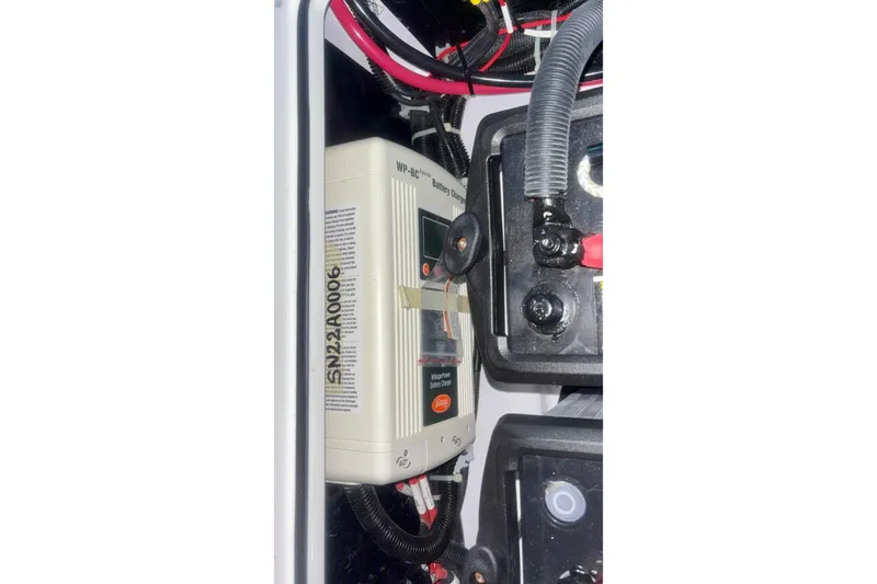 Slide: The Image of Electrical components and wiring inside a 2024 Axopar 37 XC Cross Cabin boat. - 81
