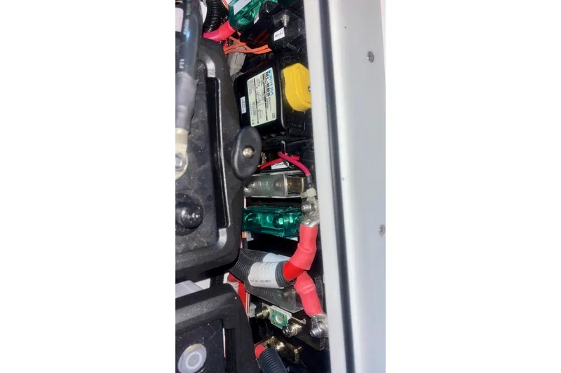 Slide: The Image of 2024 Axopar 37 XC Cross Cabin engine compartment with blue machinery. - 83