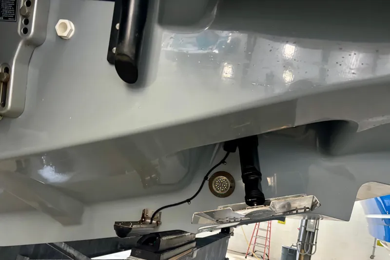 Slide: The Image of 2024 Axopar 37 XC Cross Cabin boat in a storage facility, side view. - 9