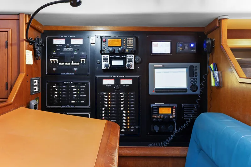 Slide: The Image of Electrical control panel on 2006 Island Packet 440 yacht, featuring navigation and communication equipment. - 14
