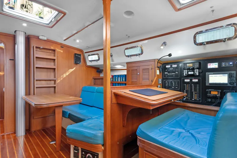 Slide: The Image of Interior of 2006 Island Packet 440 yacht with blue seating and navigation equipment. - 17