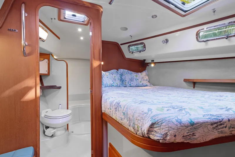 Slide: The Image of Luxurious cabin interior of 2006 Island Packet 440 yacht with cozy bed and ensuite bathroom. - 23