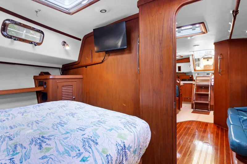Slide: The Image of Interior of 2006 Island Packet 440 yacht with wood finish and cozy cabin. - 24