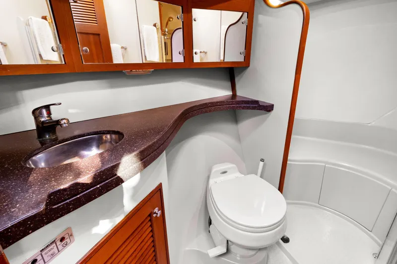 Slide: The Image of Luxurious 2006 Island Packet 440 yacht bathroom with modern fixtures and elegant wood accents. - 28