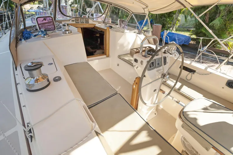 Slide: The Image of Cockpit of 2006 Island Packet 440 sailboat with steering wheel and navigation instruments. - 8