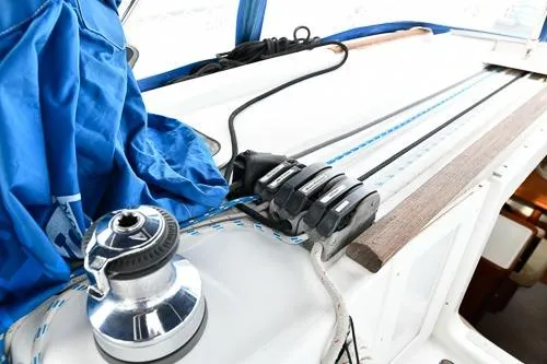 Slide: The Image of Close-up of Beneteau Oceanis 46 sailboat rigging, 2008 model, featuring pulleys and blue cover. - 16