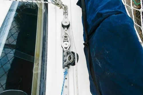 Slide: The Image of 2008 Beneteau Oceanis 46 sailboat docked, featuring a spacious deck and protective netting. - 17