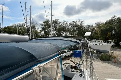 Slide: The Image of 2008 Beneteau Oceanis 46 sailboat docked in a marina with other vessels. - 28