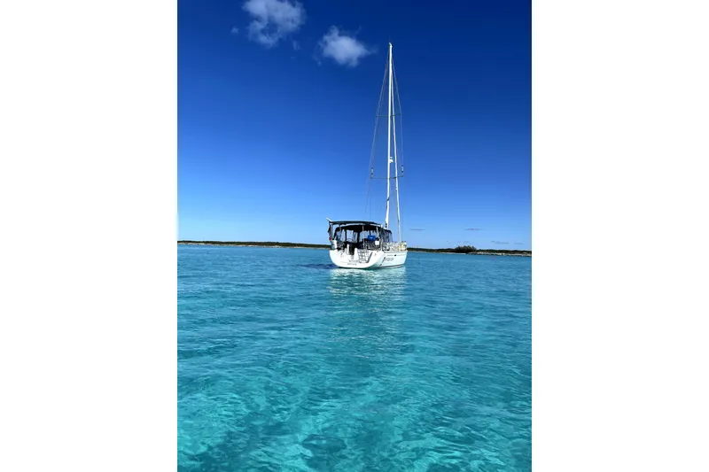 Slide: The Image of Sailboat Beneteau Oceanis 46 (2008) on clear turquoise water under a bright blue sky. - 3