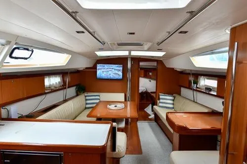 Slide: The Image of Interior of 2008 Beneteau Oceanis 46 yacht with elegant seating and modern amenities. - 30