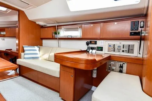 Slide: The Image of Interior of 2008 Beneteau Oceanis 46 yacht with beige sofa and wooden finish. - 34