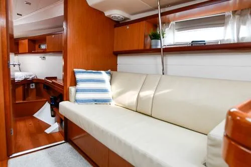 Slide: The Image of Interior of 2008 Beneteau Oceanis 46 yacht with wood finish and navigation controls. - 36