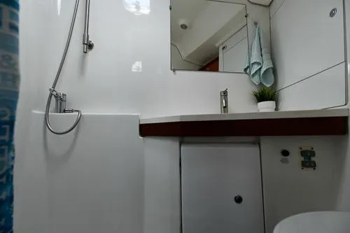 Slide: The Image of 2008 Beneteau Oceanis 46 yacht cabin with cozy bed and wooden interior. - 38