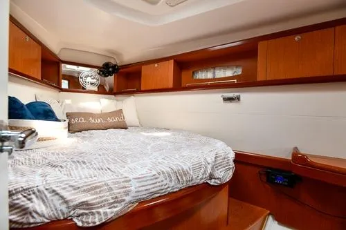Slide: The Image of Interior of 2008 Beneteau Oceanis 46 yacht with wooden cabinetry and seating area. - 39