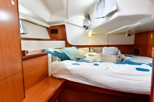 Slide: The Image of Interior of 2008 Beneteau Oceanis 46 yacht with cozy cabin and modern decor. - 45