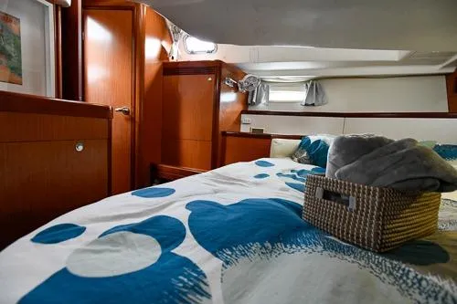 Slide: The Image of 2008 Beneteau Oceanis 46 yacht bathroom with shower and wooden cabinetry. - 48