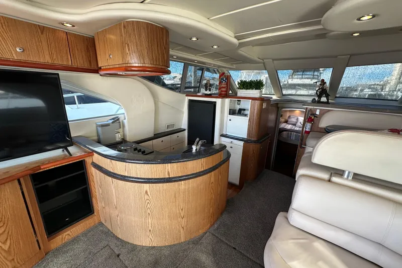 Slide: The Image of Luxurious interior of 2000 Maxum 4600 SCB yacht with modern amenities and elegant design. - 12