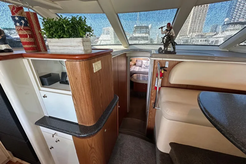 Slide: The Image of Interior of 2000 Maxum 4600 SCB yacht with wood accents and nautical decor. - 14