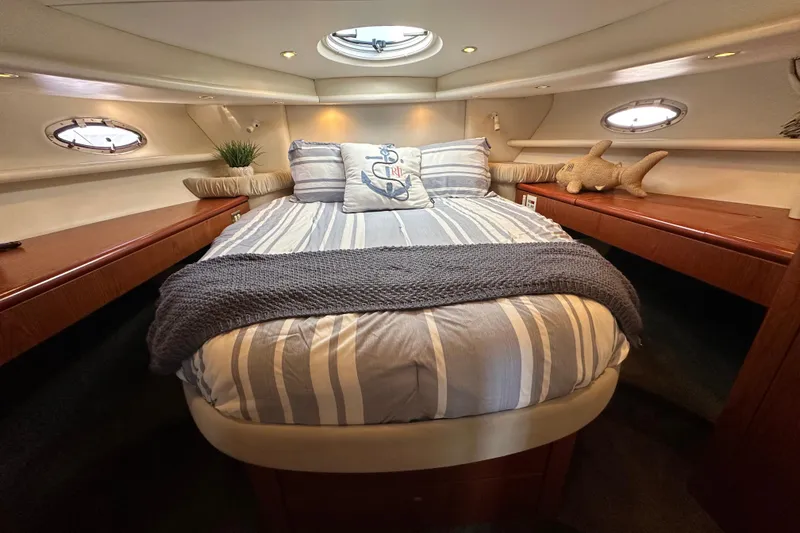 Slide: The Image of Luxurious cabin interior of 2000 Maxum 4600 SCB yacht with cozy bedding. - 15