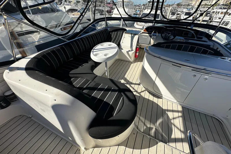 Slide: The Image of Luxurious 2000 Maxum 4600 SCB yacht interior with elegant seating and table. - 28
