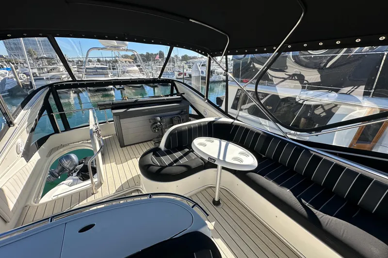 Slide: The Image of Luxurious 2000 Maxum 4600 SCB yacht interior with sleek seating and marina view. - 30