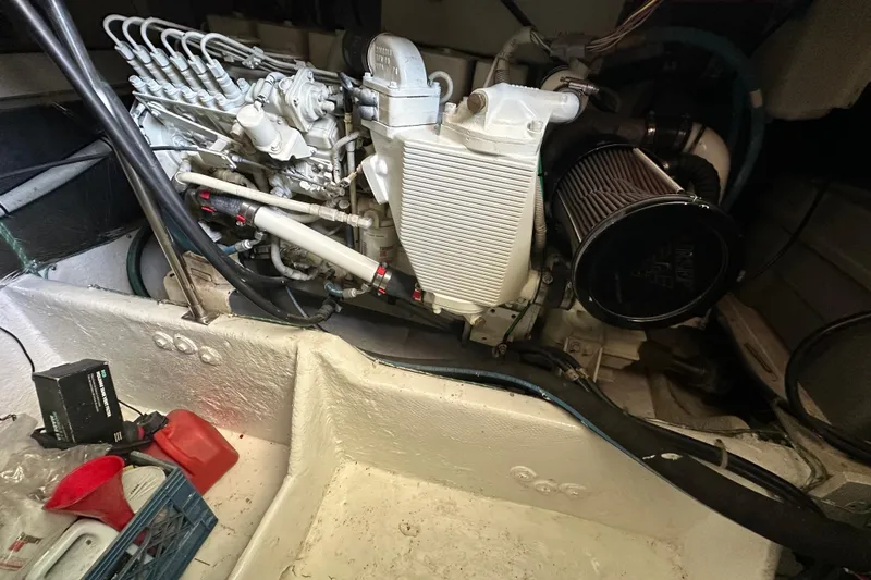 Slide: The Image of Engine compartment of a 2000 Maxum 4600 SCB yacht, showcasing mechanical components. - 46