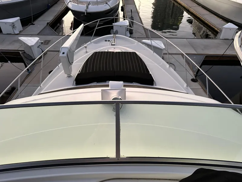 Slide: The Image of Maxum 4600 SCB 2000 docked at a serene marina. - 50
