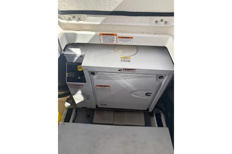Slide: The Image of Cummins Onan generator in 2019 Back Cove 34O boat engine compartment. - 24
