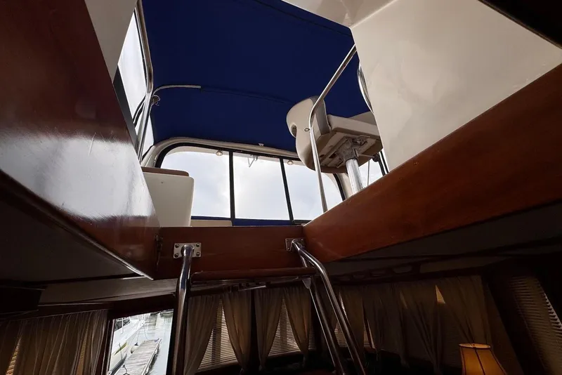 Slide: The Image of Interior view of 1988 Jefferson 52 Monticello yacht, showcasing upper deck and seating area. - 10