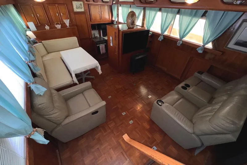 Slide: The Image of Luxurious interior of 1988 Jefferson 52 Monticello yacht with leather seating and elegant decor. - 32
