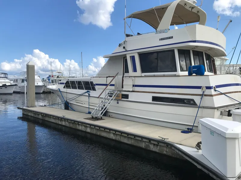 Slide: The Image of Interior of 1988 Jefferson 52 Monticello yacht with cozy seating and wooden cabinetry. - 38