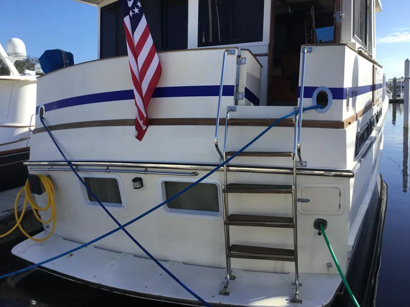 Slide: The Image of Luxurious bedroom interior of 1988 Jefferson 52 Monticello yacht with elegant decor and wood finishes. - 41