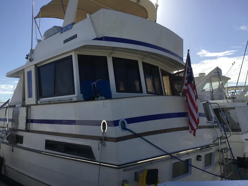 Slide: The Image of Luxurious 1988 Jefferson 52 Monticello yacht interior with elegant woodwork and decorative vases. - 42