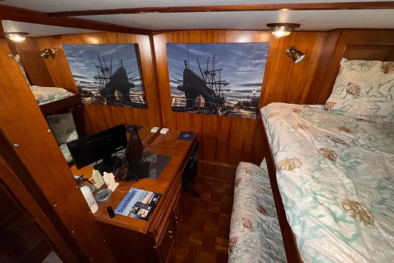 Slide: The Image of Cozy cabin interior of 1988 Jefferson 52 Monticello yacht with bunk beds and desk. - 49