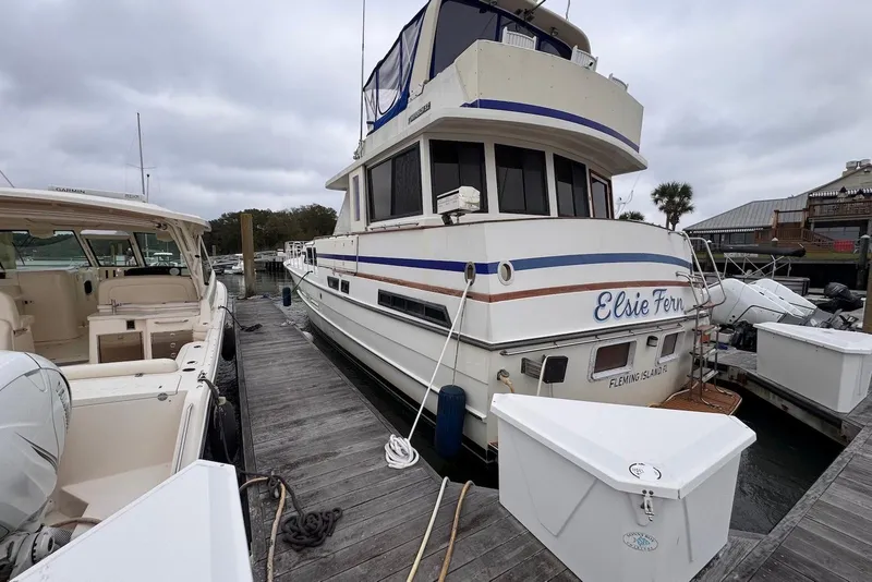 Slide: The Image of 1988 Jefferson 52 Monticello yacht docked at marina, named "Elsie Fern." - 5