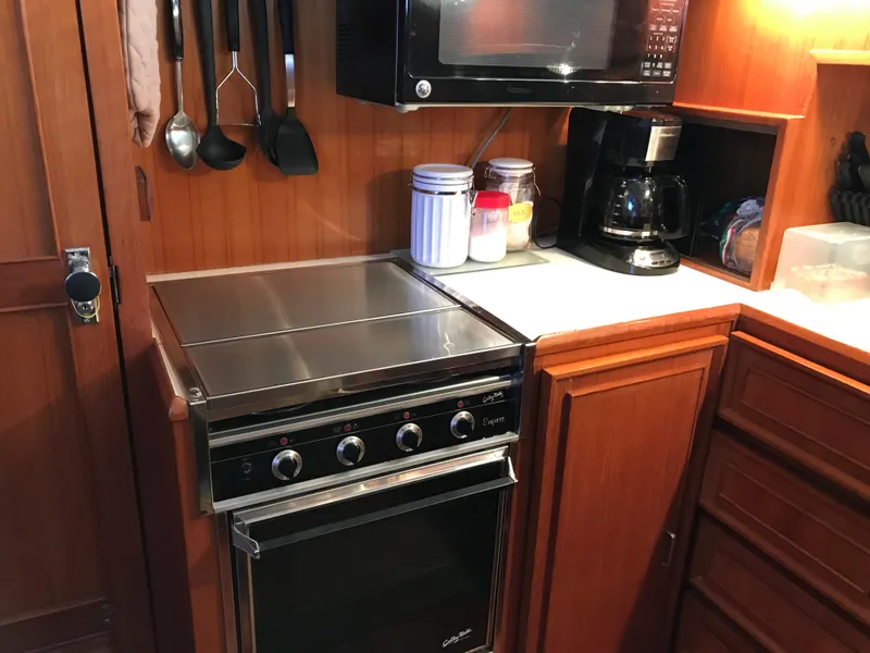 Slide: The Image of Cozy cabin interior of 1988 Jefferson 52 Monticello with bunk beds and nautical decor. - 50