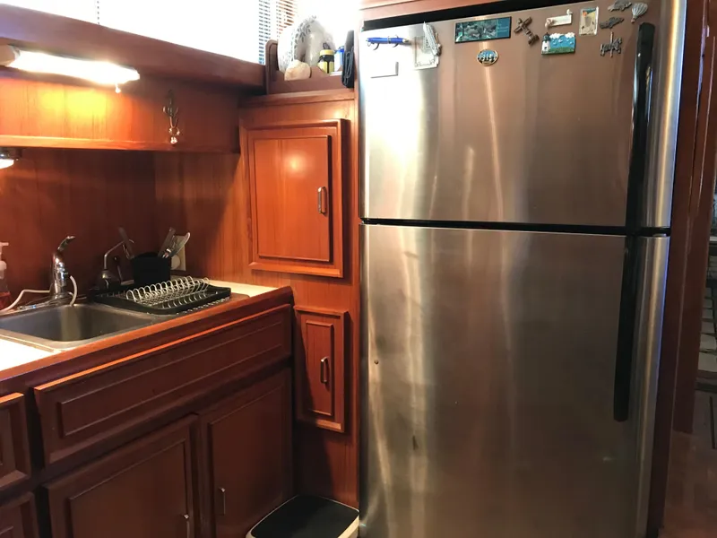 Slide: The Image of Cozy cabin interior with wooden bunk beds in 1988 Jefferson 52 Monticello yacht. - 51