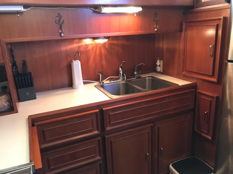 Slide: The Image of Cozy cabin with wooden bunk beds in 1988 Jefferson 52 Monticello yacht. - 52