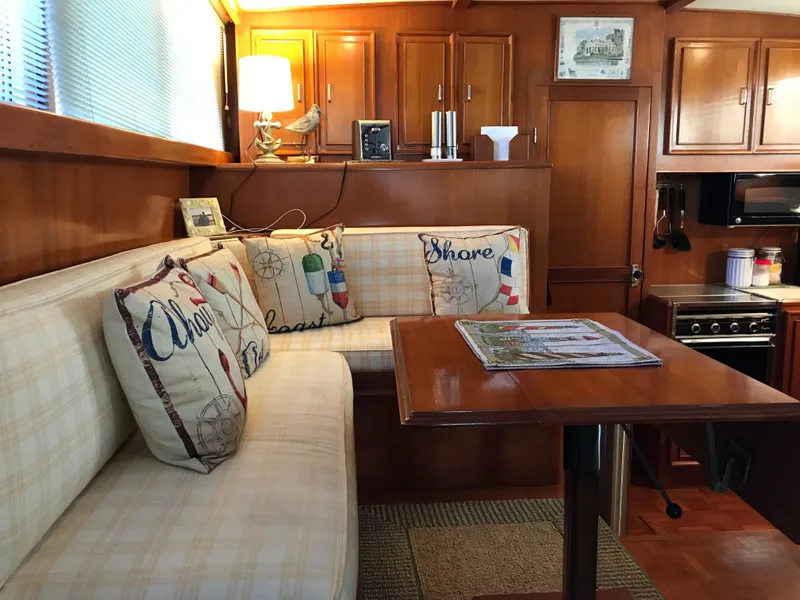 Slide: The Image of Cozy cabin interior of 1988 Jefferson 52 Monticello yacht with wooden paneling and bunk beds. - 53