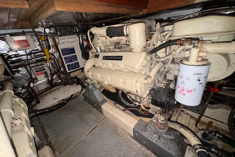 Slide: The Image of Engine room of a 1988 Jefferson 52 Monticello yacht with Caterpillar engine. - 59