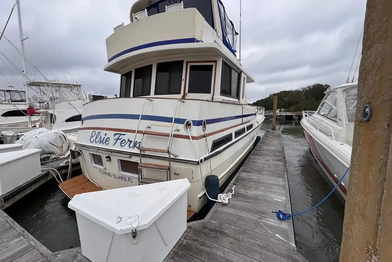 Slide: The Image of 1988 Jefferson 52 Monticello yacht docked, named "Elsie Fern," at Fleming Island marina. - 6