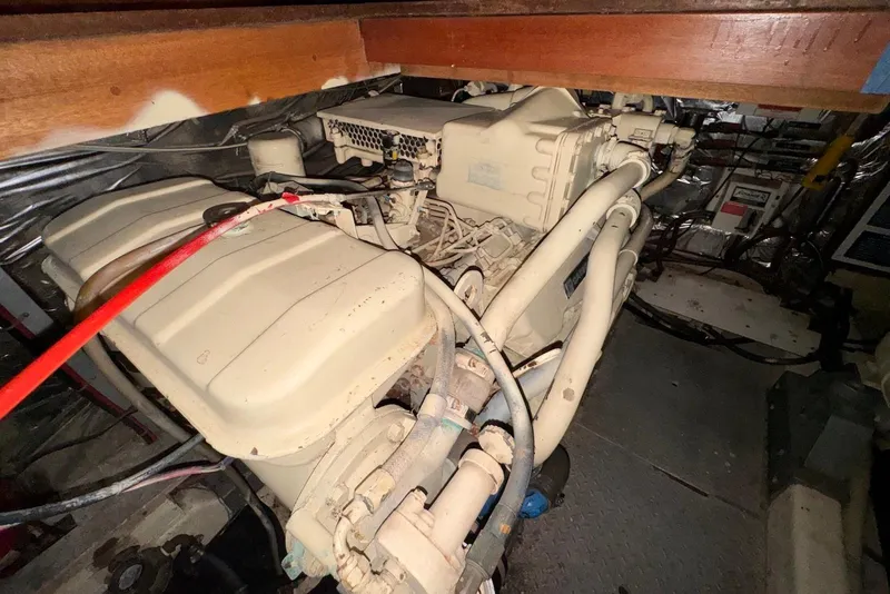 Slide: The Image of Engine compartment of a 1988 Jefferson 52 Monticello yacht, showcasing mechanical components. - 62