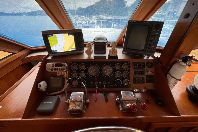 Slide: The Image of Cockpit of 1988 Jefferson 52 Monticello yacht with navigation equipment and controls. - 9