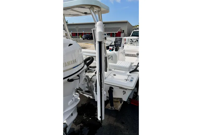 Slide: The Image of 2024 Outlaw Legend 17 boat with Yamaha engine, docked outdoors. - 33