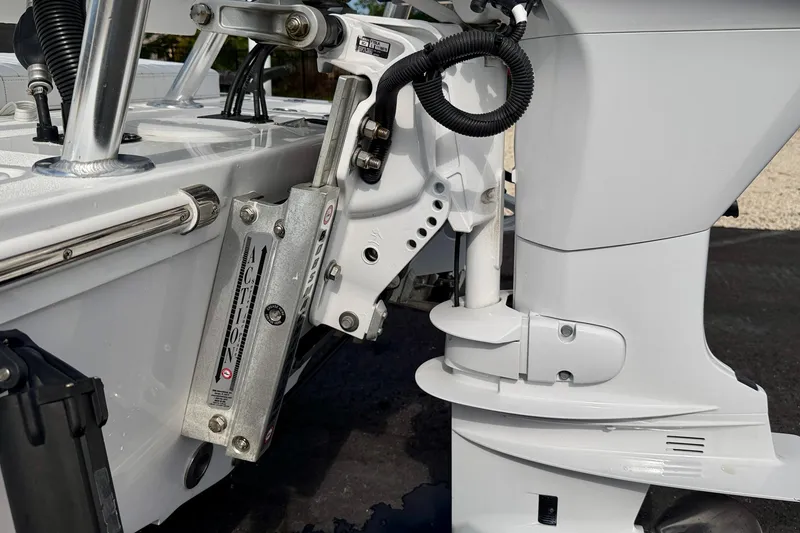 Slide: The Image of 2024 Outlaw Legend 17 boat engine detail with hydraulic components and sleek design. - 34