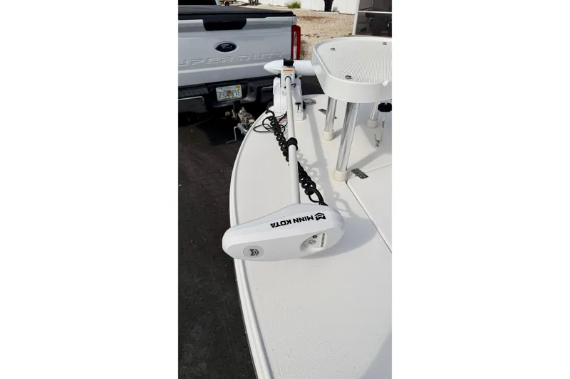Slide: The Image of 2024 Outlaw Legend 17 boat with Minn Kota trolling motor on deck. - 36