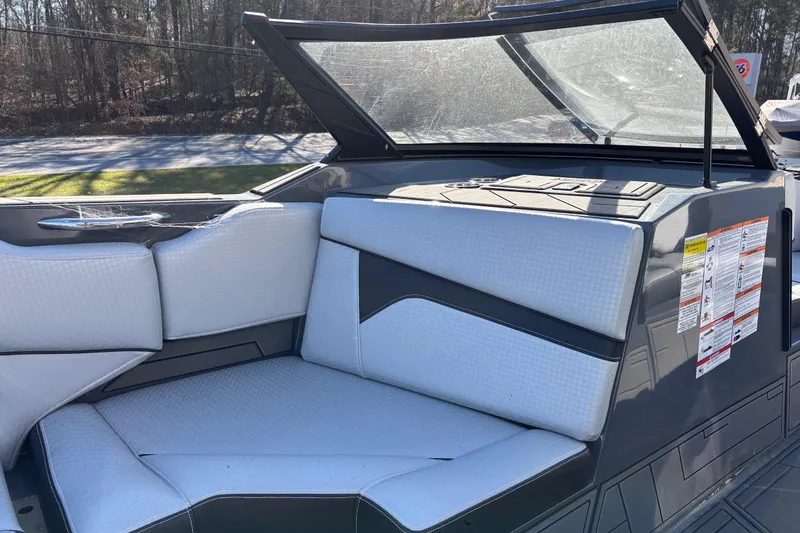 Slide: The Image of 2023 Supreme ZS232 boat interior with sleek gray and white seating design. - 11
